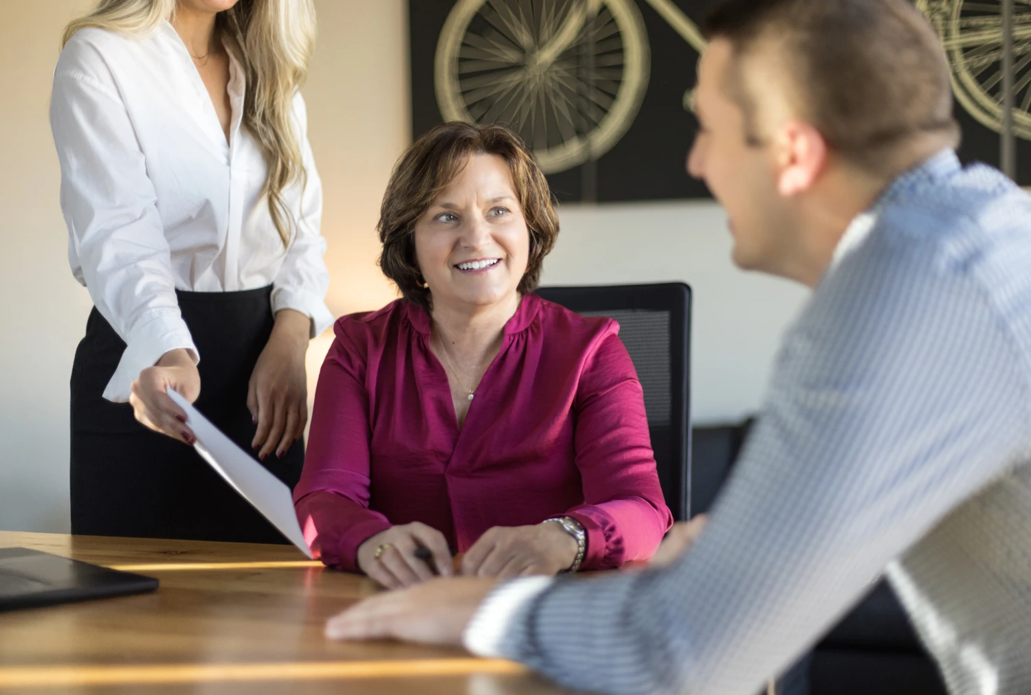 Catherine Stoddard consulting with two clients