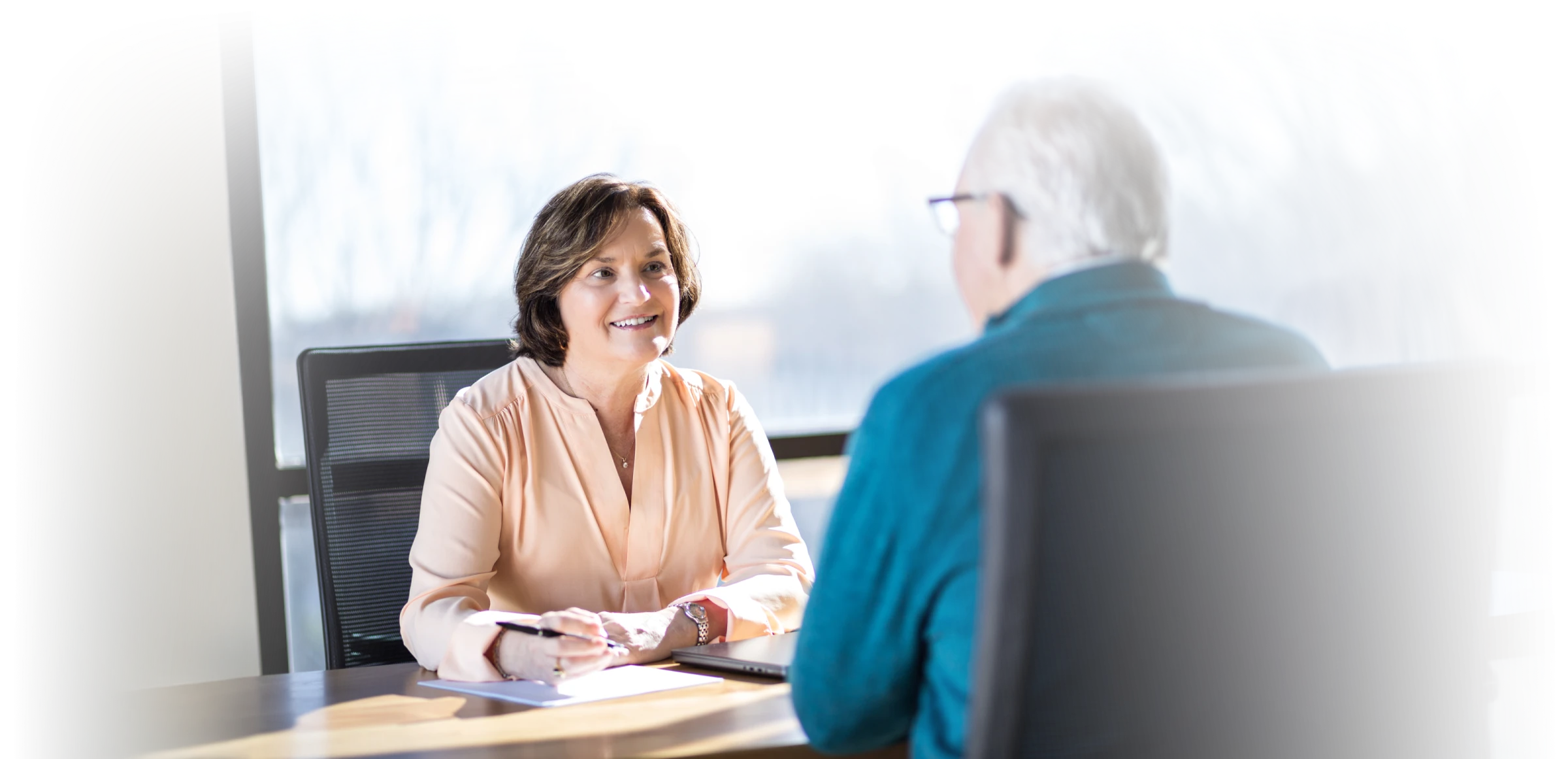 Catherine Stoddard meeting with a client